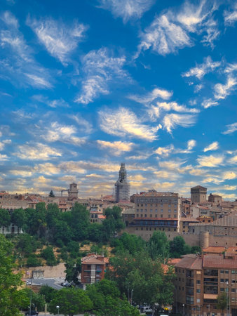 Trees in the hill of Segovia with medieval city in the ceter of Spainの写真素材