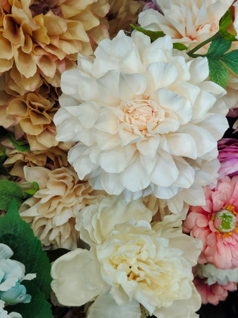 Several flowers of coloures forming a background