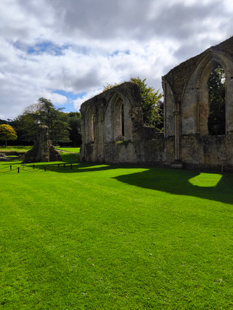 Ancient church ruins in Glastonbury on a cloudy dayの写真素材