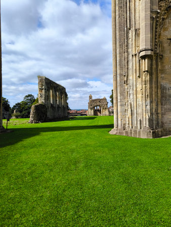 Ancient church ruins in Glastonbury in a cloudy dayの写真素材