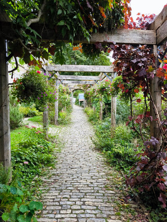 Garden with flowers in Glastonbury in the south of England in a cloudy dayの写真素材