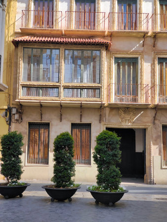 Street of Murcia capital with tipycal architecture in a sunny dayの写真素材