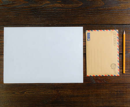 Mockup letter on the wooden table with pencil.の写真素材