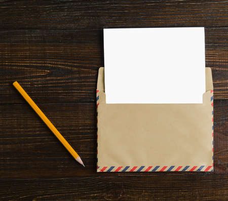 Mockup letter on the wooden table pencil.の写真素材