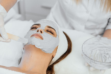 Cosmetic beauty mask for face in beauty salon. Spa procedures, relaxation and skin care.の写真素材