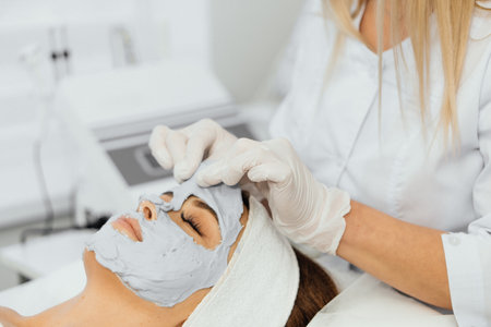 Cosmetic beauty mask for face in beauty salon. Spa procedures, relaxation and skin care.の写真素材
