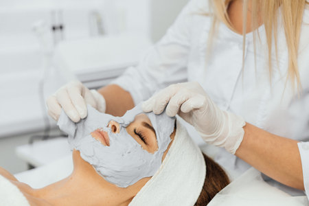 Cosmetic beauty mask for face in beauty salon. Spa procedures, relaxation and skin care.の写真素材