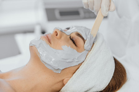 Cosmetic beauty mask for face in beauty salon. Spa procedures, relaxation and skin care.の写真素材