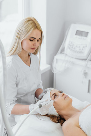 Radiofrequency facial skin lifting. Hardware cosmetology RF lifting procedure and hardware massageの写真素材
