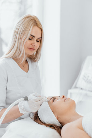 Radiofrequency facial skin lifting. Hardware cosmetology RF lifting procedure and hardware massageの写真素材