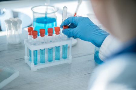 Medical research laboratory. A scientist works with a pipette and a test tube. Scientific laboratoryの写真素材