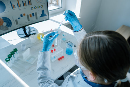 A medical professional working with medical devices in a laboratory to diagnose and control statistics and patients health. Study of properties of chemical compounds use in medicine.の写真素材