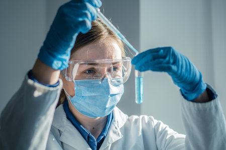 Photo shows chemist working on new technologies in a medical laboratory to improve diagnosis and treatment of diseases. Experiment in biological laboratory to determine effectiveness new medication.の写真素材