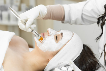 Spa therapy for the face: this photo shows how the procedure of applying a cosmetic mask turns ordinary skin care into exclusive spa therapy for the face. A woman relaxes and restsの写真素材