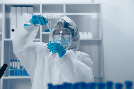 A dedicated scientist is actively conducting a variety of experiments within a controlled laboratory...
