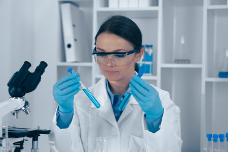 Scientist Analyzing Samples in a Modern Laboratory Settingの写真素材