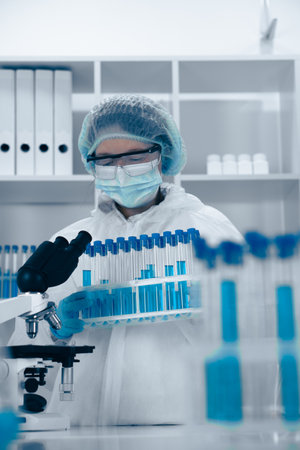 A scientist is diligently analyzing various samples in a cuttingedge, hightech laboratory environment that is equipped with modern tools and technology to advance scientific research and innovationの写真素材