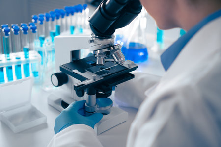 Conducting meticulous laboratory research with advanced microscopes and various test tubes allows scientists to perform detailed analyses in fields like biochemistry, biotechnology, and healthcareの写真素材