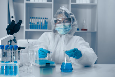 An experienced scientist is conducting intricate and detailed experiments in a stateoftheart modern lab, showcasing both precision and collaboration in groundbreaking and innovative researchの写真素材