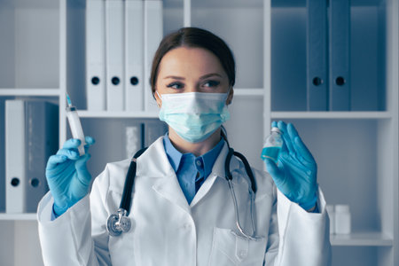 A qualified medical professional is diligently analyzing vaccine samples within a stateoftheart laboratory, ensuring both safety and effectiveness in the crucial development of vaccinesの写真素材