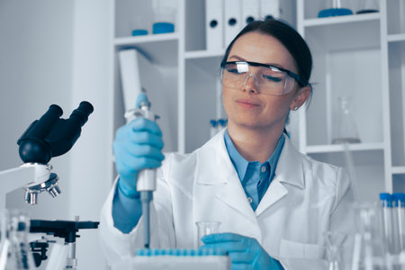 A dedicated scientist is conducting groundbreaking research in a stateoftheart lab, focusing on biotechnology, chemistry, and genetics to advance our understanding of these vital sciencesの写真素材