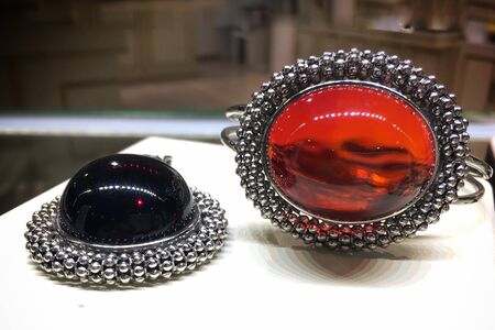 Luxurious silver jewelry with Mexican amber insert.. Template for jewelry store design.の写真素材