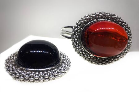 Expensive silver jewelry with red Mexican amber. Template for jewelry store design.の写真素材