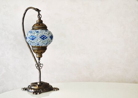 Mosaic glass lamp in oriental style on a gray background. Place for text.の写真素材