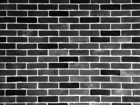 Old brick wall in grunge style. Monochrome photography. Background for design and decoration.の写真素材