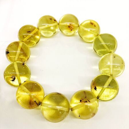 bracelet made of large transparent round amber ballsの写真素材