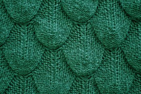Realistic knitted texture closeup in green . Fashionable cconcept.の写真素材