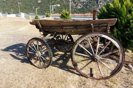 A cart with large wheels from the last century.