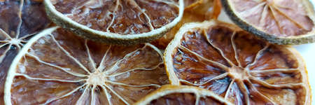 dry lemon wedges on white backgroundの写真素材