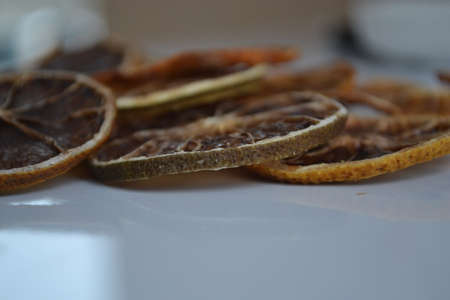 Natural background of round dry slices of red grapefruit