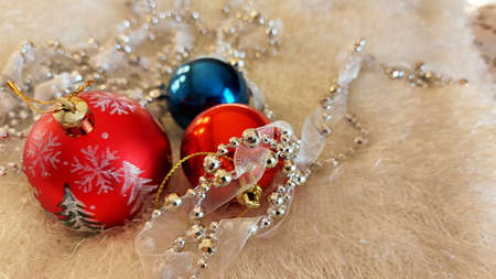 Vintage Christmas balls and bead decorations on a white bedspreadの写真素材