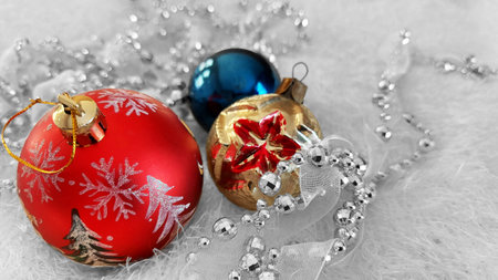 Vintage Christmas balls and bead decorations on a white bedspreadの写真素材