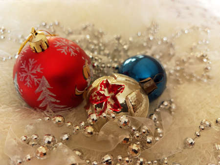 Vintage Christmas balls and bead decorations on a white bedspreadの写真素材