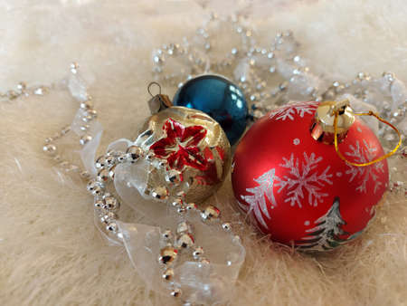 Vintage Christmas balls and bead decorations on a white bedspreadの写真素材