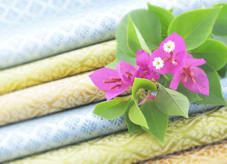 Bougainvillea flowers on stack Thai fabricの写真素材