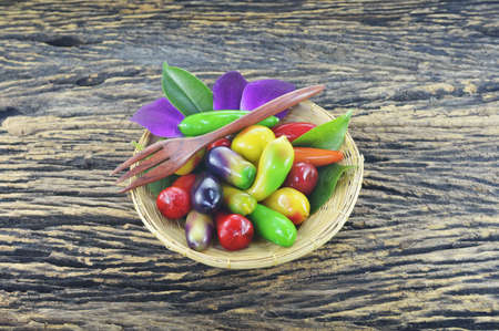 Colorful of Traditional Thai Dessert by nut in fruit style on wooden plateの写真素材