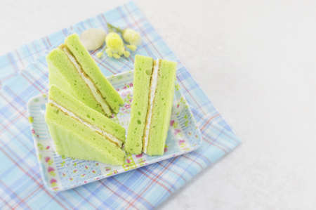 green chiffon cake on a blue dishの写真素材