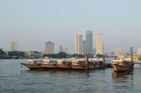 BANGKOK - JAN 5  Taxi boats transporting passengers on January 5, 2014 in Bangkok, Thailand  Chao Phraya river is a waterway for both cargo and passenger transport for the city のeditorial素材
