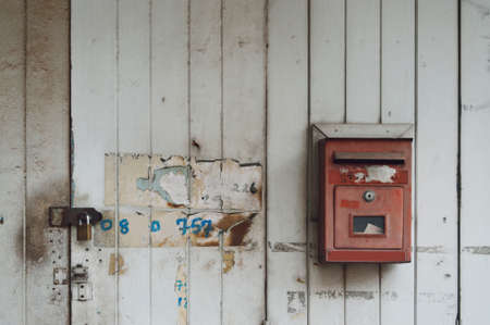 old mail box on the dirty doorの写真素材
