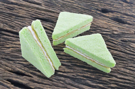 green chiffon cake on wooden boardの写真素材