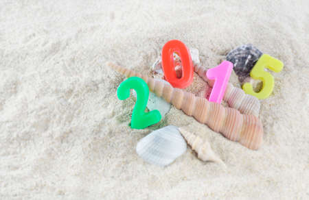 Multicolored new year 2015 on the beachの写真素材