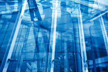 Busy life over buildings reflections, Abstract modern city backgroundの写真素材