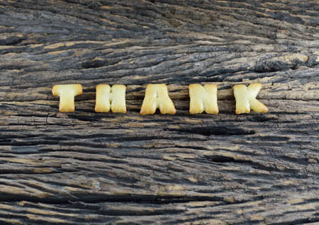 An image of Thank on wooden backgroundの写真素材