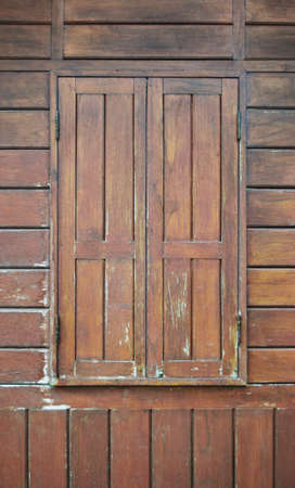 Paint peeling wooden old wall texture detailの写真素材