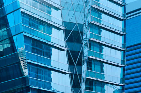 Glass front of a modern office building, Bangkok Thailandの写真素材