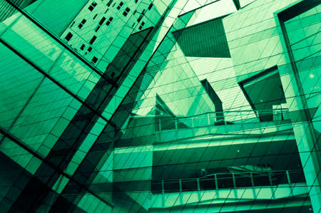 Glass of modern tower for business background, green toneの写真素材